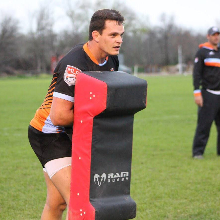 Ram Rugby Double Wedge Hit Shield in black and red with durable PVC and foam, designed for safe tackle practice impact absorption