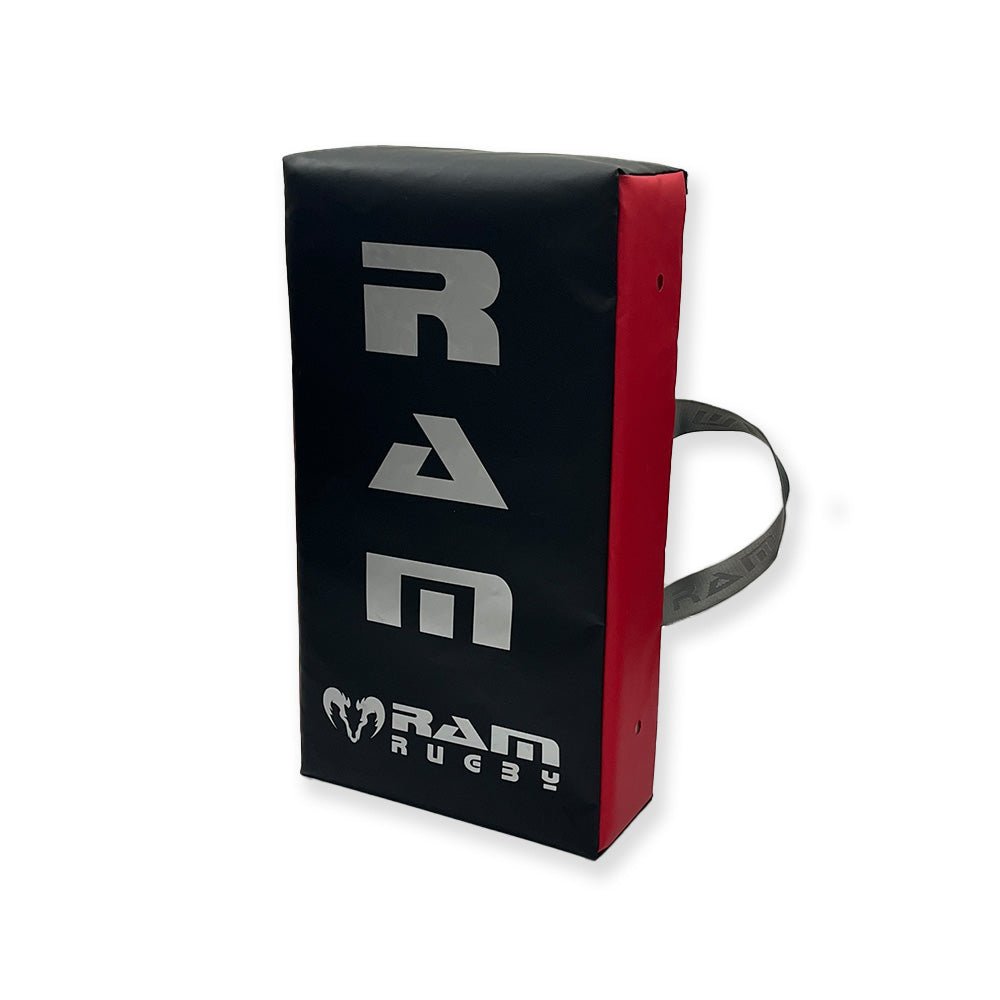 Ram Rugby Flat Hit Shield in black and red with durable PVC shell and foam core, designed for rugby training and impact drills