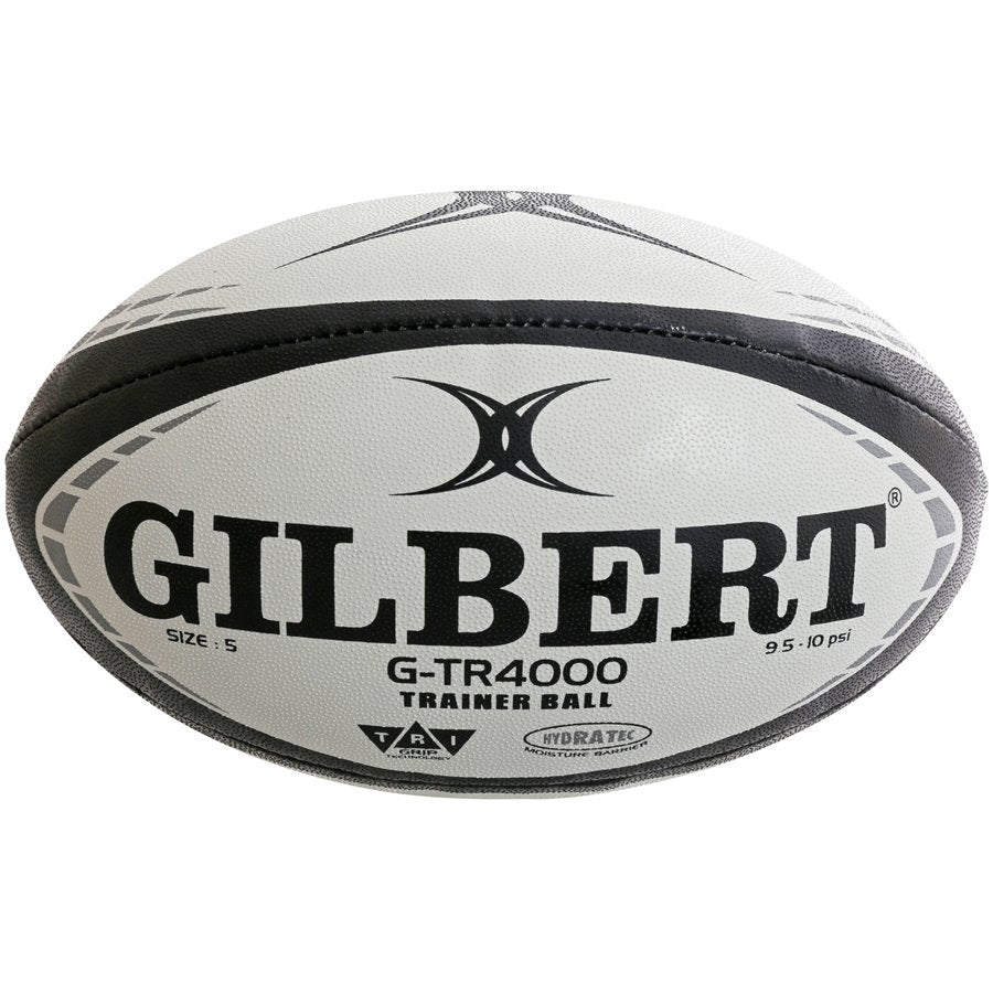 Thirty Gilbert G-TR4000 trainer rugby balls stacked with two large breathable bags for size 5 ball storage and transport