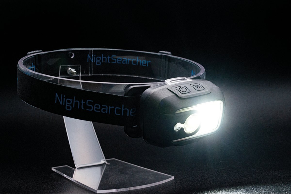 Nightsearcher Lightwave 520 Head Torch showing adjustable elastic strap and compact, black rechargeable design