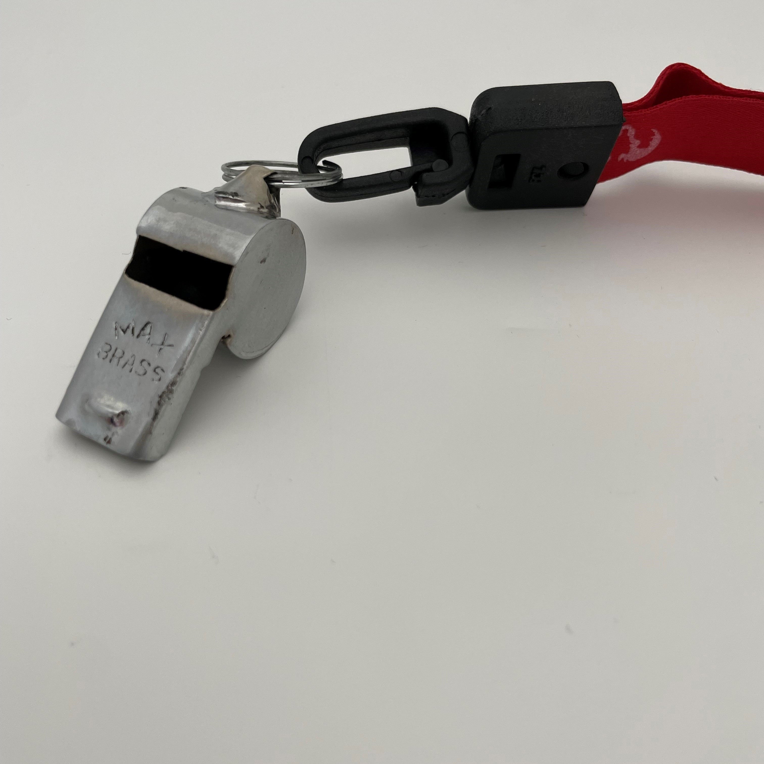 Ram Rugby metal whistle with durable silver design and bright red lanyard, ideal fitness and sports accessory for referees