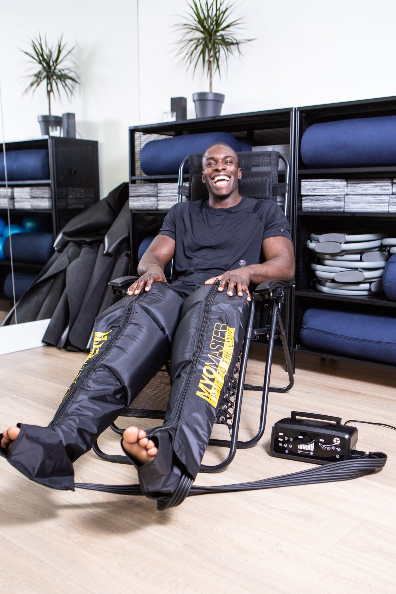 Myomaster MyoPump Compression Leg Massage device showing adjustable straps and ergonomic design for muscle recovery and blood flow