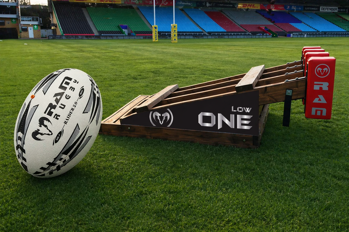 Players practising a scrum with a rugby ball being fed in