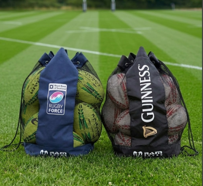 Rugby ball bags filled with balls on a rugby pitch