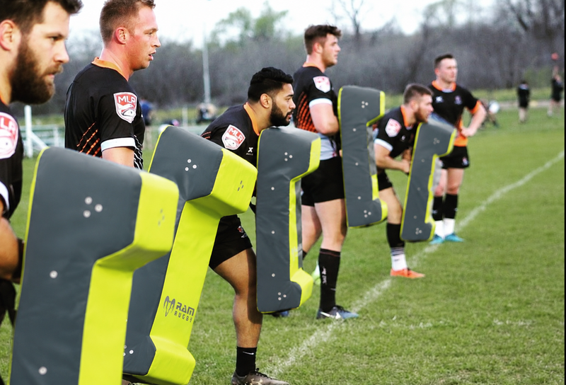 Rugby players training contact with RAM hit shields
