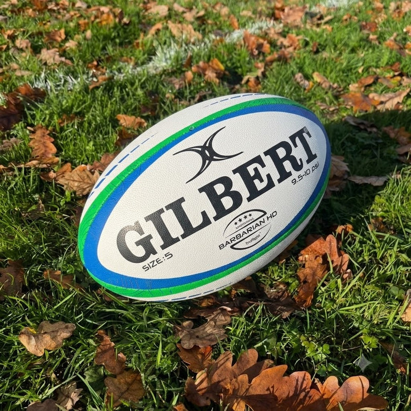Gilbert match rugby ball on autumn grass