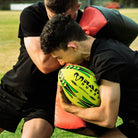 Ram Rugby Curve Hit Shield in blue, showing curved design for rugby training, contact drills, and skill development