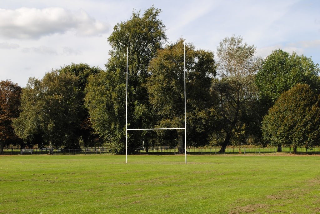 Ram Rugby 10m aluminium fixed socketed rugby goal posts set in white with two-piece uprights and crossbar for professional use