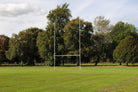 Ram Rugby 10m aluminium fixed socketed rugby goal posts set in white with two-piece uprights and crossbar for professional use