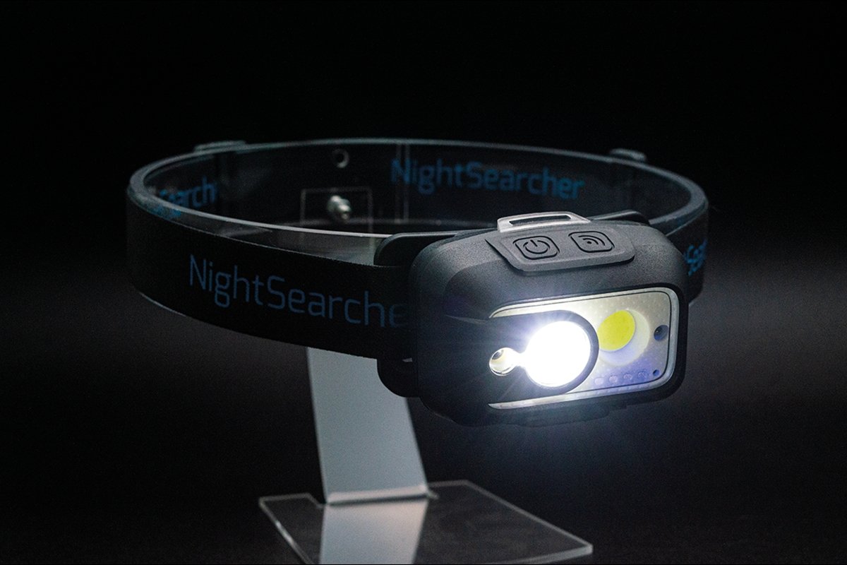 Nightsearcher Lightwave 520 rechargeable head torch showing adjustable strap and dual beam LED lights for outdoor use