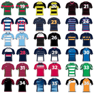 Men wearing Ram Rugby Pro Fit Sublimated rugby shirts in black and red showing stretch fabric and athletic fit detail.